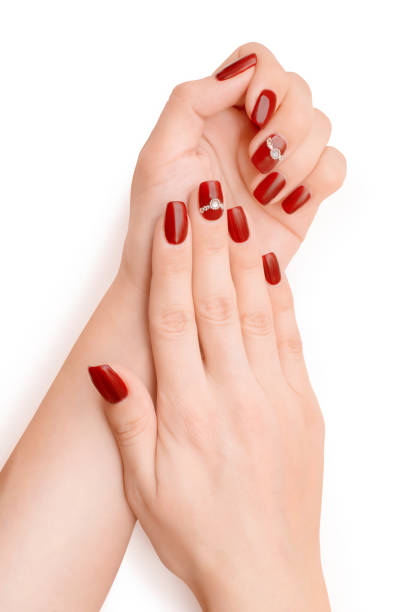 istock Woman hands with red nail polish isolated with clipping path 876738034