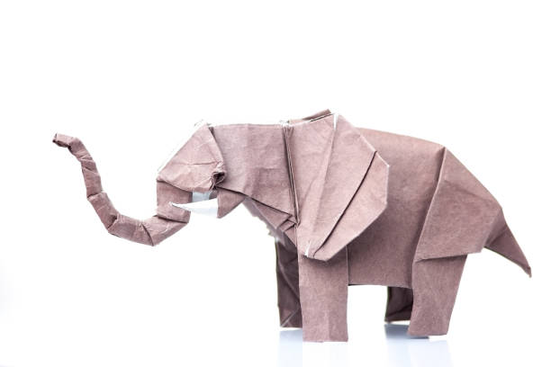 istock Brown elephant origami figurine 876740672