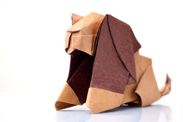 istock Lion origami miniature on white 876740782