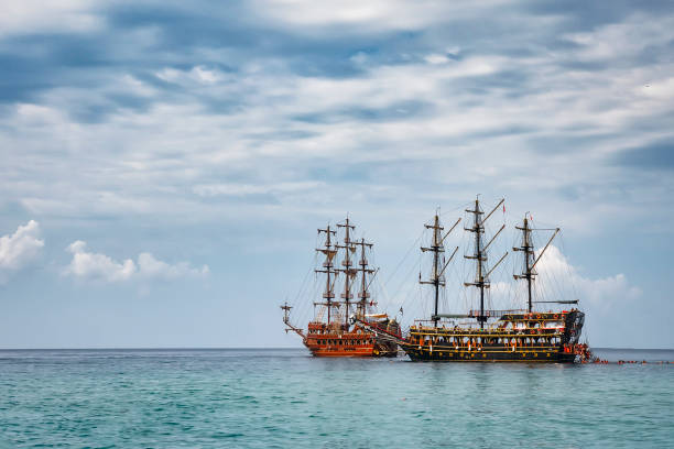 istock Two ships in the sea in cloudy weather. 876740944