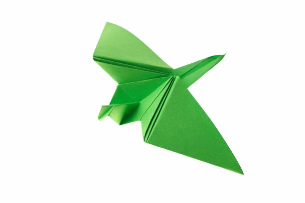 istock Green paper crane on white 876741766
