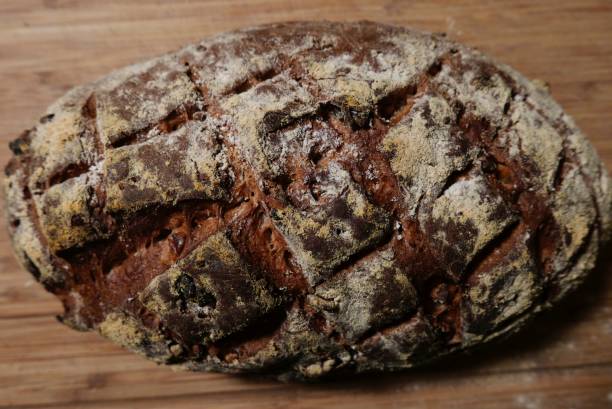istock Loaf of walnut bread showing cross hatch slash marks 876756138