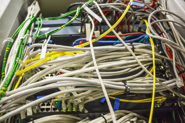 istock Many fiber optic cables in server room close up, modern internet technology 876767382