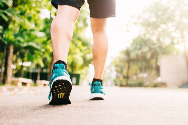 istock runner feet start to jogging in morning 876767532