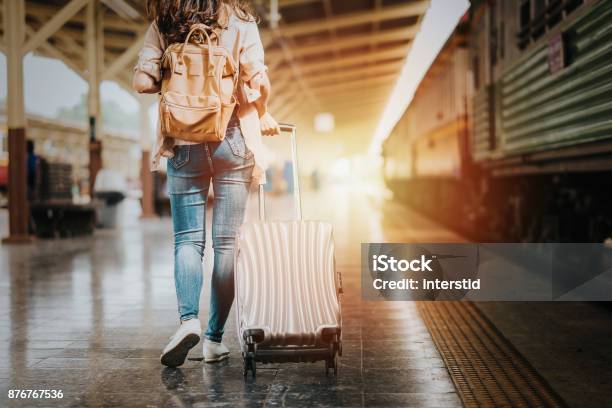 Woman Traveler Tourist Walking With Luggage To Start Her Journey Stock Photo - Download Image Now