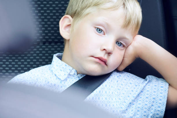 istock little boy in car safety seat 876774442