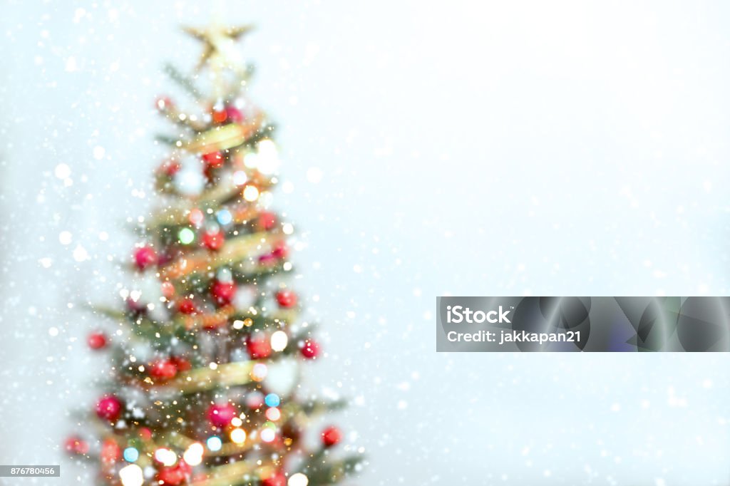 Blurred of Christmas tree Blurred of Christmas tree and light bokeh with snowfall on winter background Christmas Tree Stock Photo