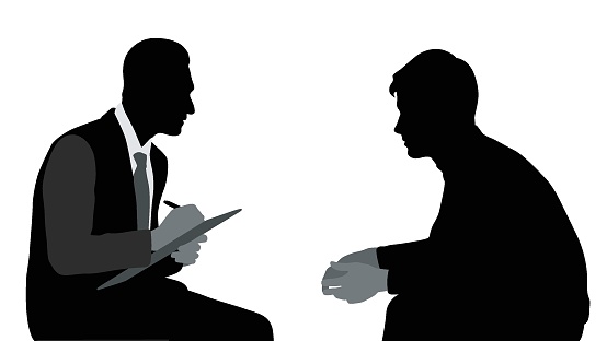 Silhouette illustration of a psychologist talking to a patient and taking notes