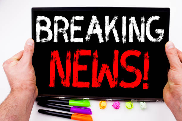 Breaking News text written on tablet, computer in the office with marker, pen, stationery. Business concept for Newspaper Breaking News white background with copy space