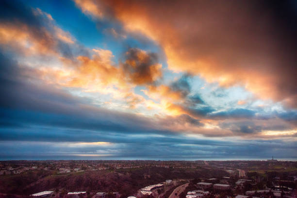 The sun setting just after a storm had cleared over Carlsbad, California located just north of San Diego.  This was shot from an altitude of about 500 feet during a helicopter photo flight.