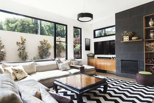 Monochrome living room with wood and grey tiling accents