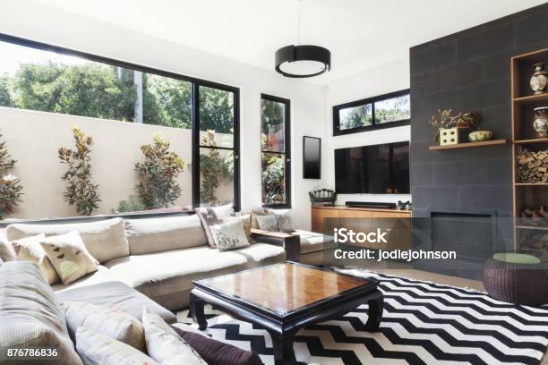 Monochrome Living Room With Wood And Grey Tiling Accents Stock Photo - Download Image Now
