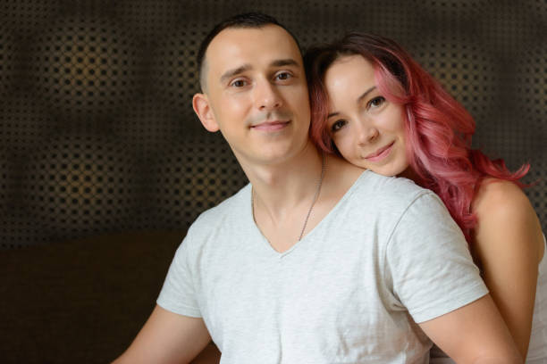 istock Young couple enjoying life together while relaxing at home 876790120