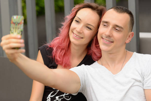 istock Young couple enjoying life together while relaxing at home 876790356