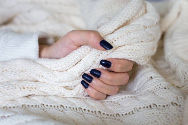 istock Beautiful female hand with dark blue nail polish design 876809418