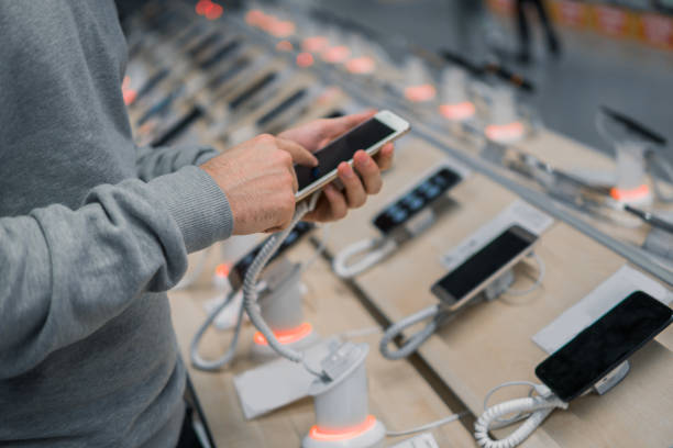 istock young male customer choosing smartphone 876810040