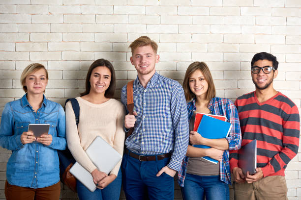 istock Cheerful Students Posing for Photography 876812732