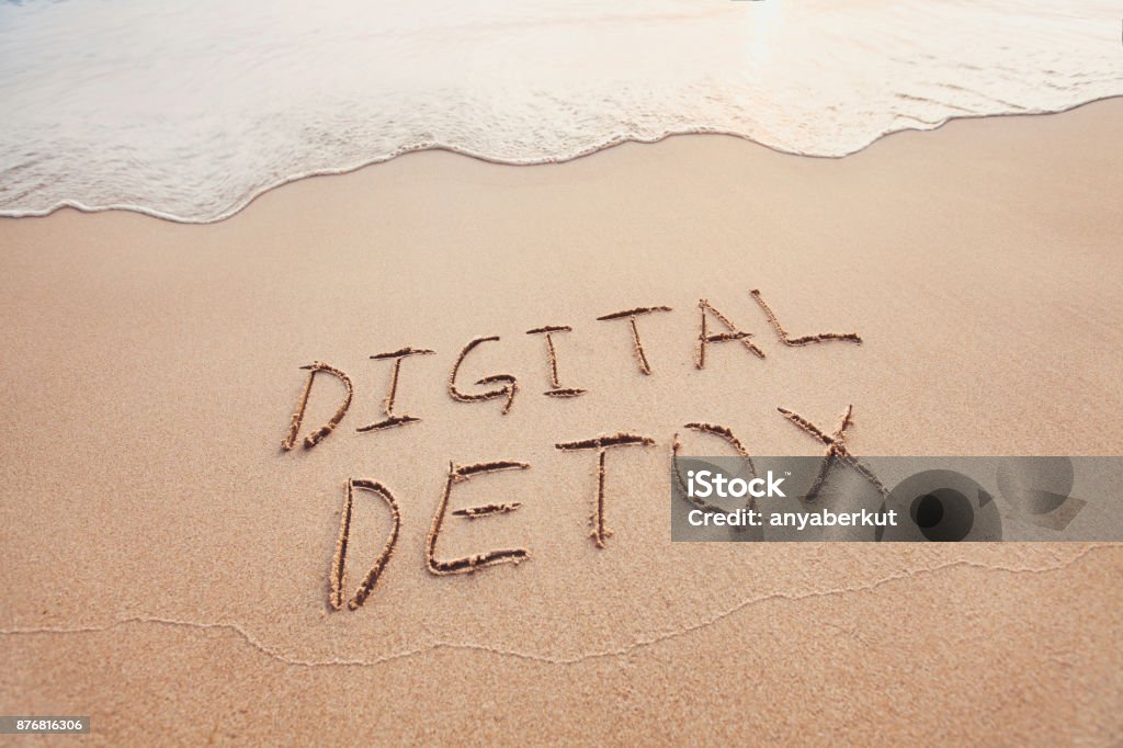 digital detox concept digital detox concept, words written on the sand of beach Detox Stock Photo
