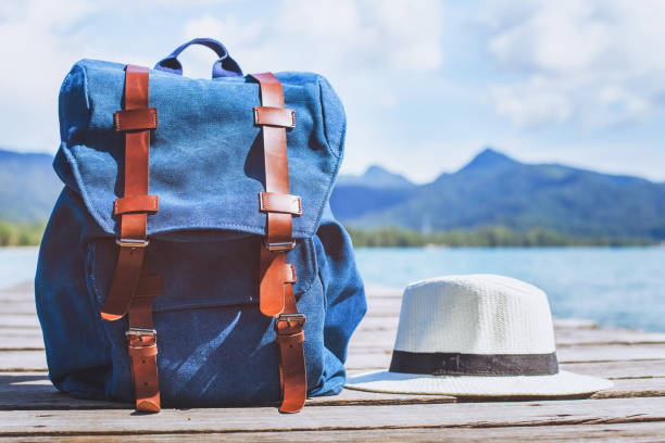 traveler backpack and hat, travel background with copy space traveler backpack and hat, ready for summer holidays trip, travel background with copy space luggage photos stock pictures, royalty-free photos & images