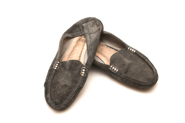 istock worn out female shoes on white isolated background 876821688