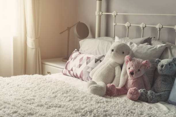 istock Group of teddy bear on bed with softlight in the morning 876822320