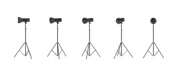 istock 3d rendering of three lights with reflectors with the head turned down and up. 876831604