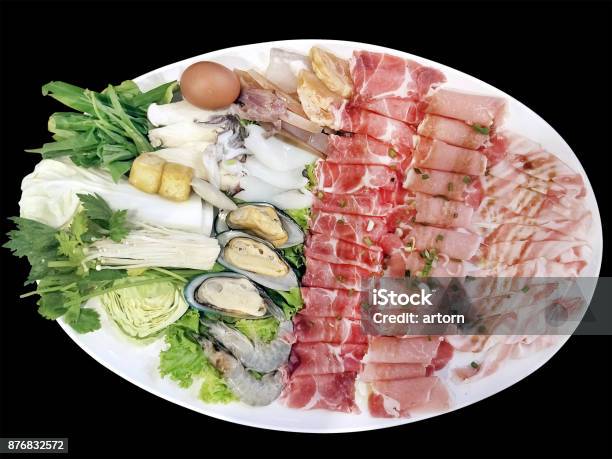 Isolated Photography On Black Background With Clipping Path Of Mix Pork Slice And Seafood Platter Set Served On Big White Plate Dish Top With Rich Soya Sauce For Shabu Or Sukiyaki Japanese Hot Pot Style Stock Photo - Download Image Now