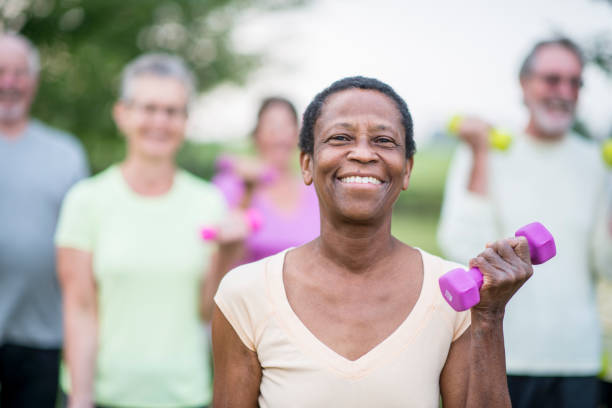 istock Smiling Woman Lifting Weights 876838284