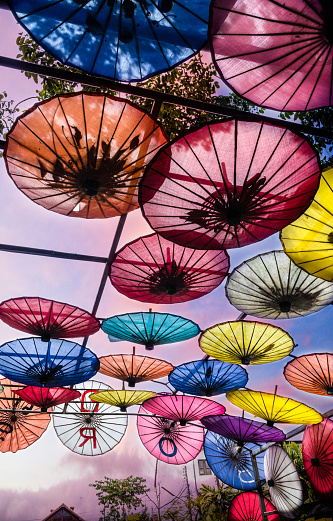 Chiang Mai, Thailand - November 5th, 2017 : Colorful painted umbrellas in a public outdoor walkway