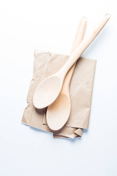 istock Wooden spoon and on a white background 876844416