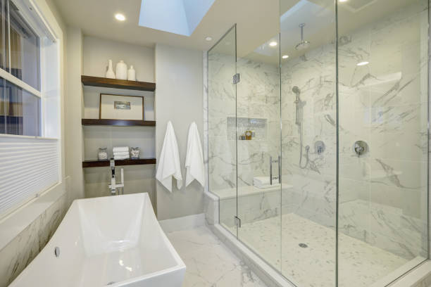 istock Amazing master bathroom with large glass walk-in shower 876854680