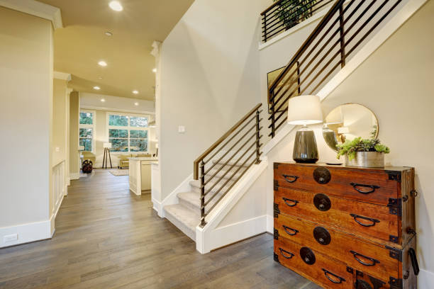 istock Light modern hallway design boasts steamer trunk dresser 876854802
