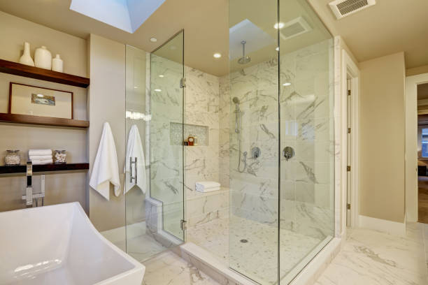 istock Amazing master bathroom with large glass walk-in shower 876855424
