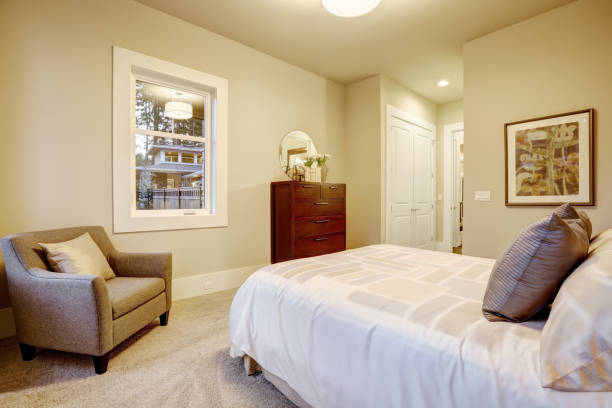 istock Natural colors bedroom interior with queen bed 876858182