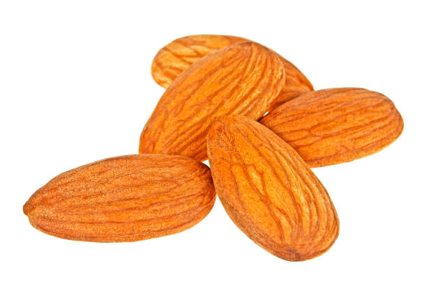 istock Heap of almond nuts isolated on white background 876858740