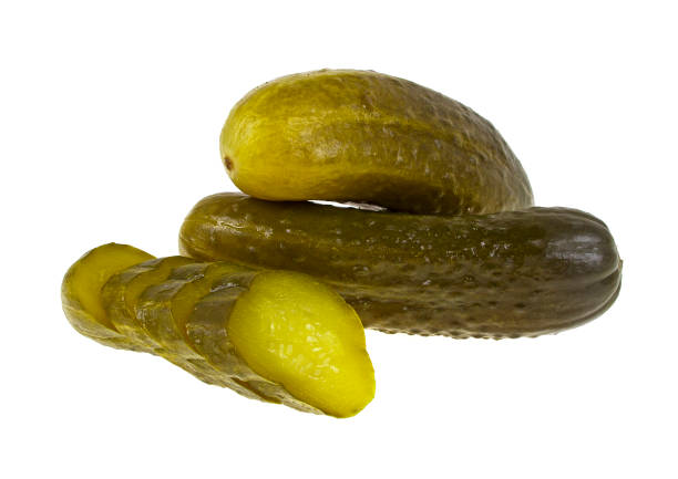 istock Marinated pickled cucumber and slices isolated on white background 876858890