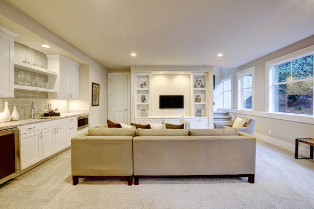 istock Chic basement living room with wet bar 876861638