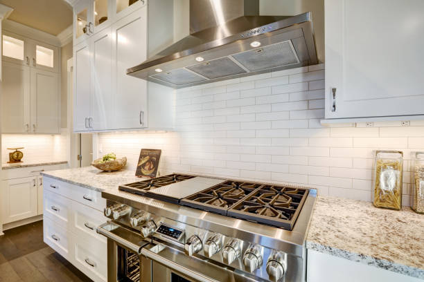 istock Beautiful kitchen features a nook filled with steel stove 876861910
