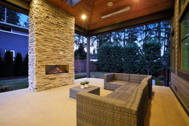 istock Chic patio design with vaulted ceiling and stone fireplace 876862162