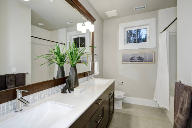 istock White and brown bathroom design in brand-new home 876865234