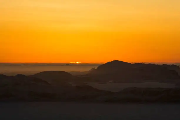 These pictures were taken at Larsemann hills at antarctica on 07-11-2017. The clear skies and the pure clarity of sky is really awesome. This picture was taken after the end of polar nights at Antarctica. There was visible mirage phenomenon and a minute view of the sun just peeping above the horizon.