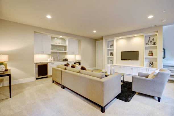 istock Chic basement living room with wet bar 876867852