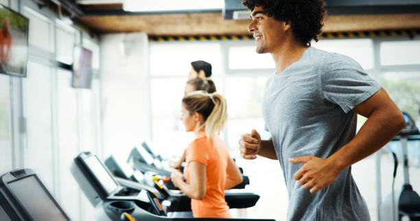 istock Young handsome man doing cardio training in gym 876868026