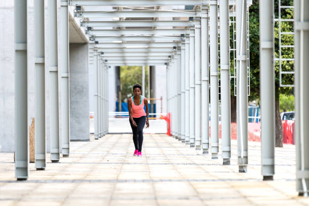 Photo of female runner running in the city