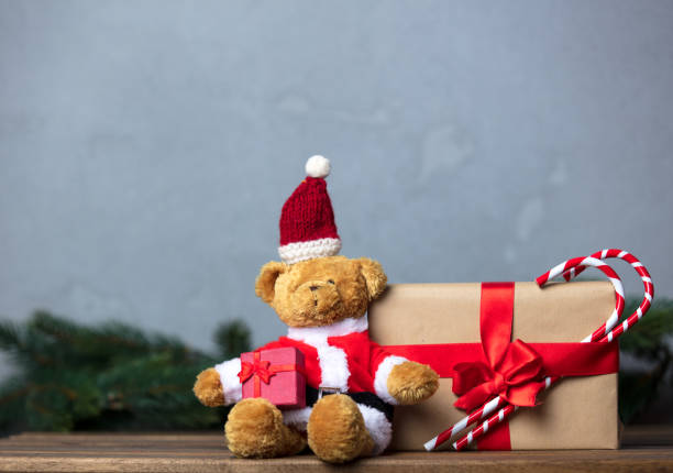 istock Christmas gifts and Teddy bear 876873718