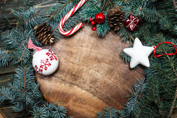 istock Christmas holiday celebration background  with  tree branches with golden baubles, stars, snowflakes and copyspace