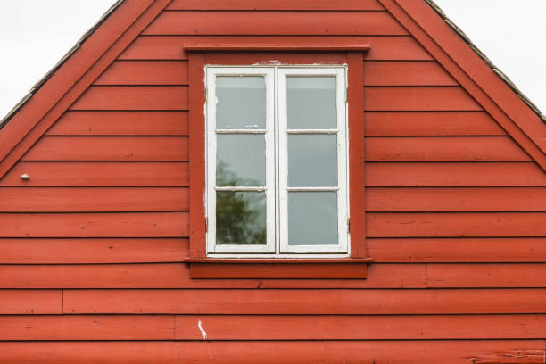 istock Old white window on wooden cottage 876877638