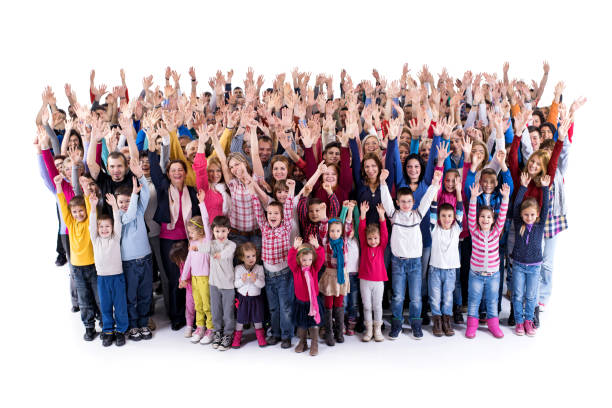 istock Large group of cheerful people with their arms raised. 876880402