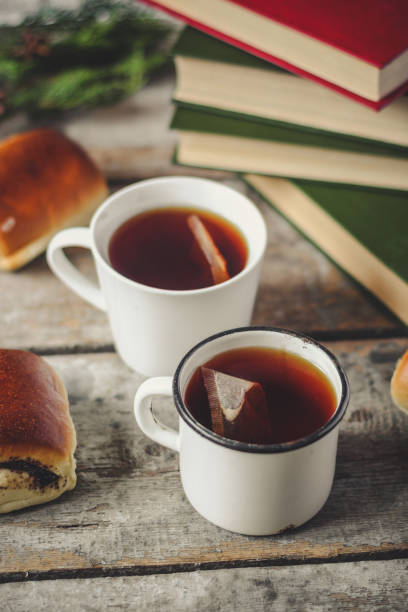 istock a cup of fresh and hot tea, and reading books 876880532
