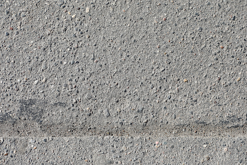 Texture of concrete. Asphalt background. Road surface. Texture of asphalt and stones on road.